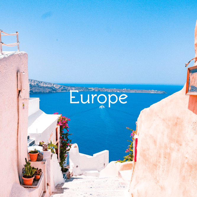 Blue Sky and Sea in Greece, with White Building Walls and Flowers