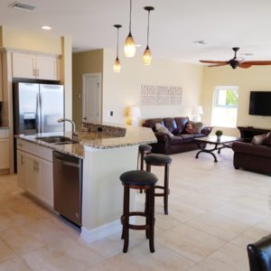 Fort-Myers-Beach-Florida-Airbnb-Option-1-Living-Room with Couch and Kitchen Island