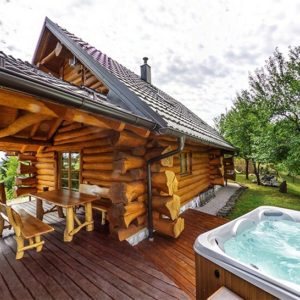 Airbnb Cabin Log Exterior view with Jacuzzi Hot Tub
