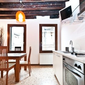 Airbnb Kitchen and dining Table with Chairs and Windows