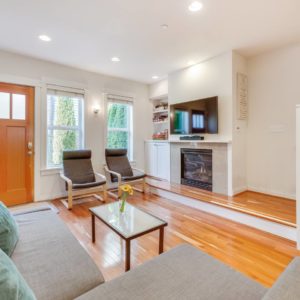 Airbnb Living Room with Fireplace and Stairs